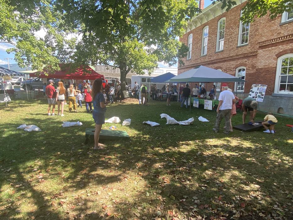 participants play cornhole