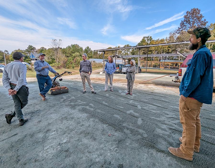 Pittsboro Market president Ben Shields with visitors