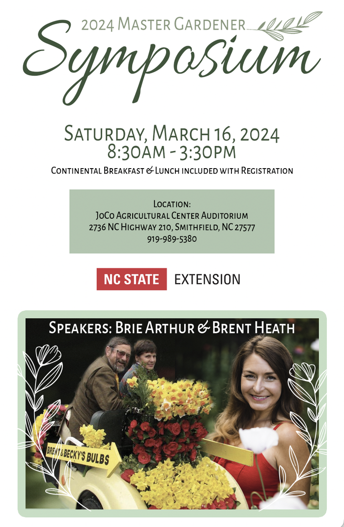 Photo of Brie Arthur and Brent Heath with yellow and red flowers
