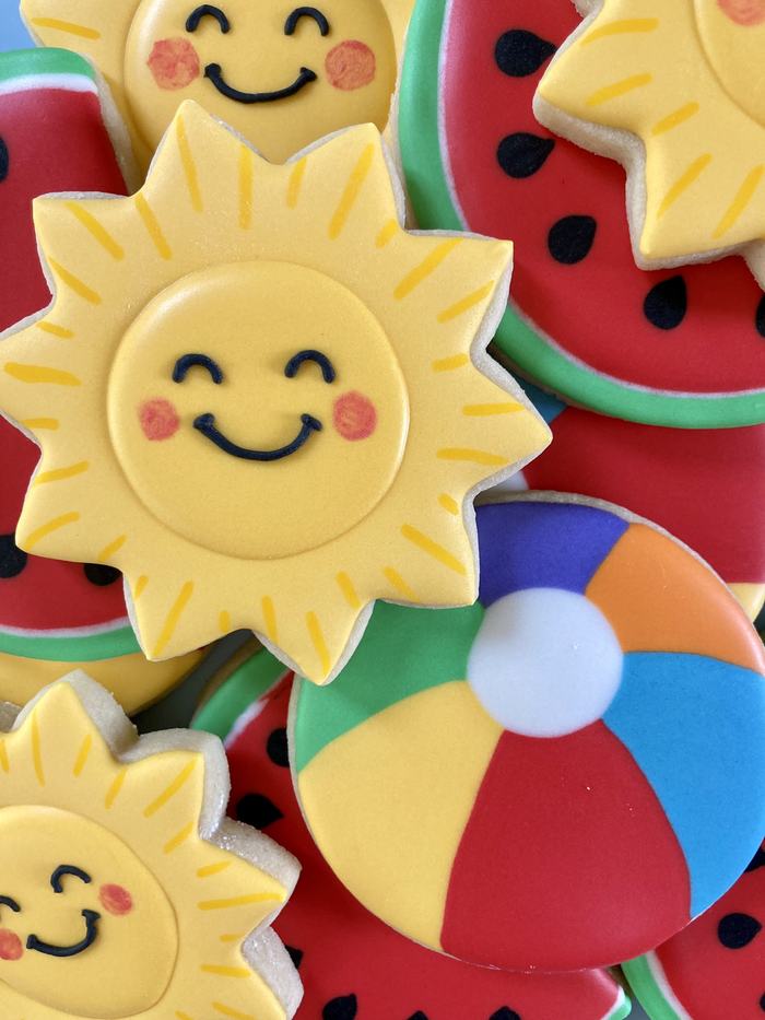Smiling sun and beach ball sugar cookies.