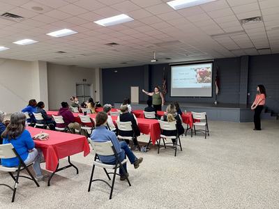Presenter addressing seated audience; projector slide reads "Thank you! sarah_ware@ncsu.edu"