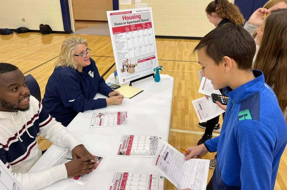 youth practicing their money management skills in a simulation