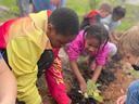school kids planting a garden