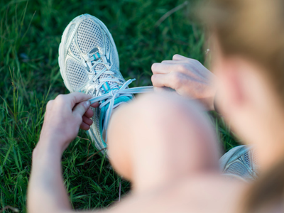 person tying shoes