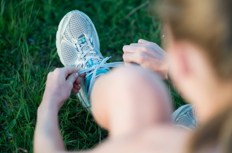 person tying shoes