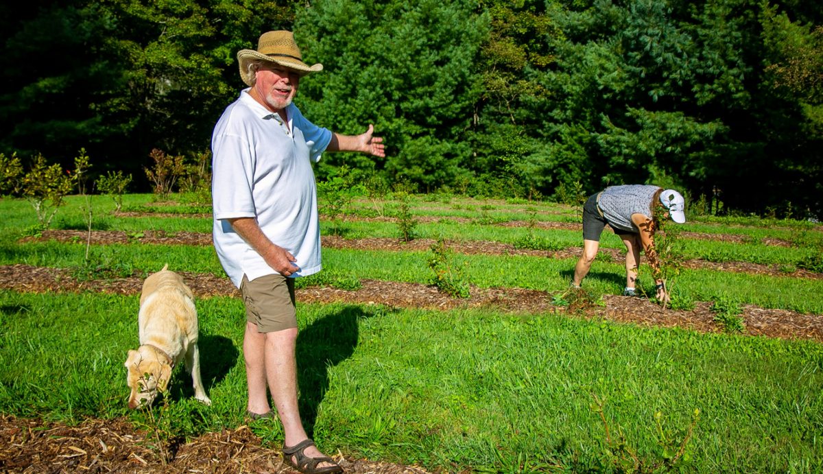 Family showing off their farm