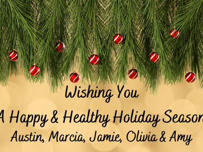 Pine branches with red ornaments; text: "Wishing You A Happy & Healthy Holiday Season"