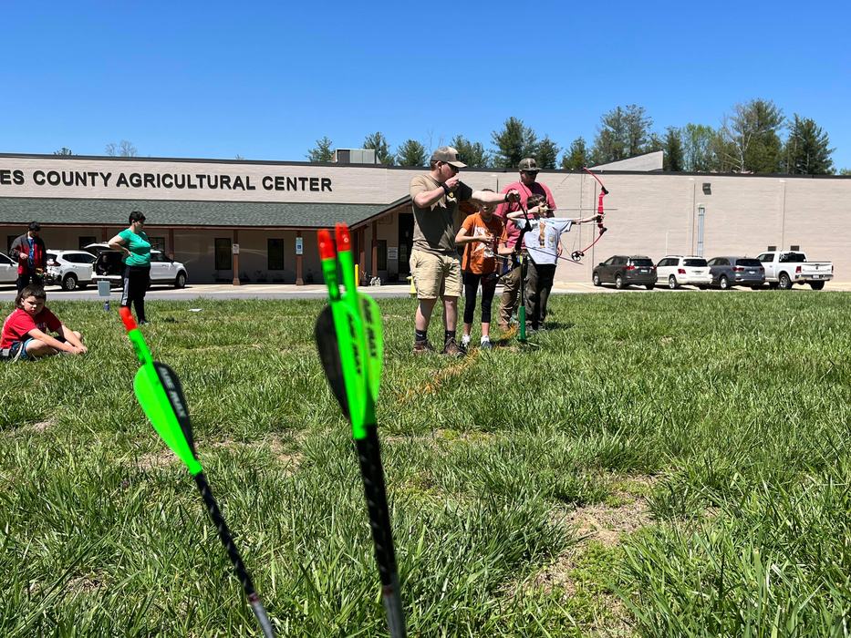 Youth attending an archery workshop.