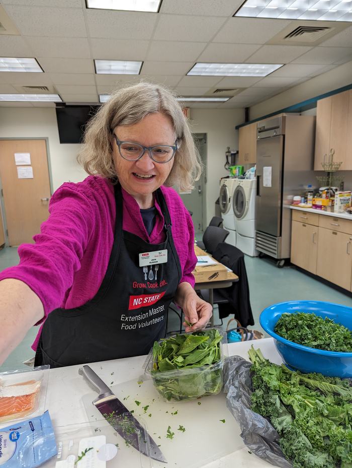 EMFV Jane Kulesza from Oak Island preparing the greens for the salad.