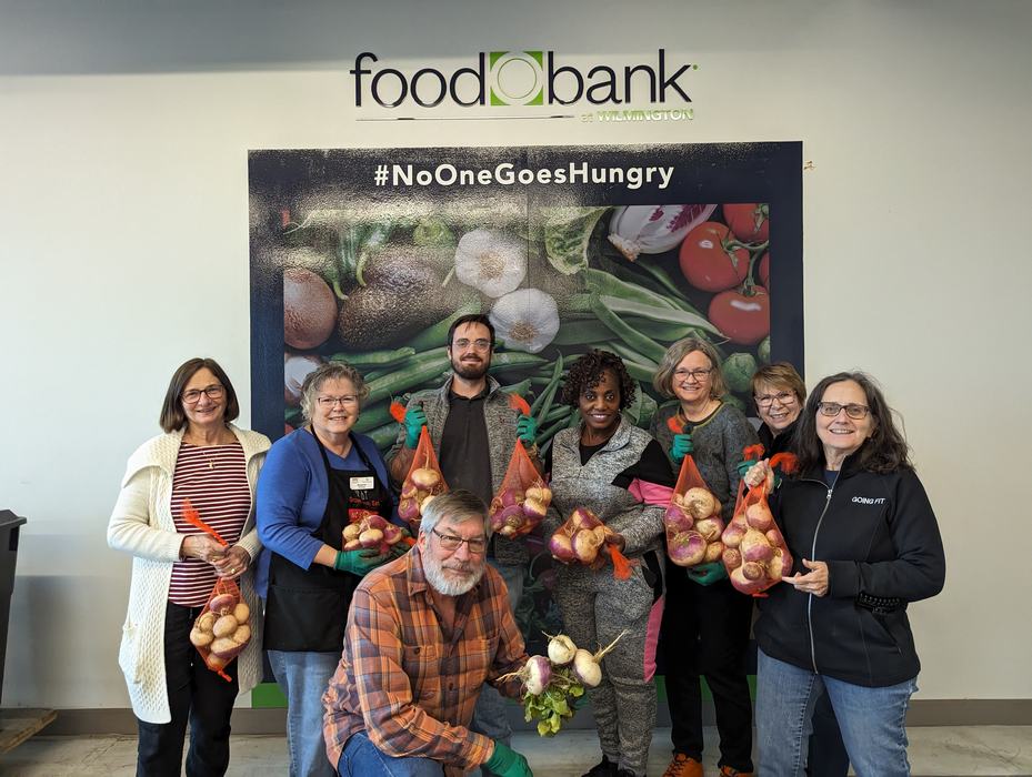 Extension Master Food Volunteers standing together at the food bank warehouse.