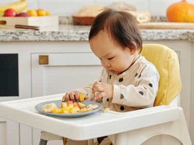 Toddler eating finger foods
