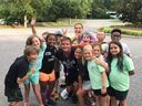 group of campers smiling at camera