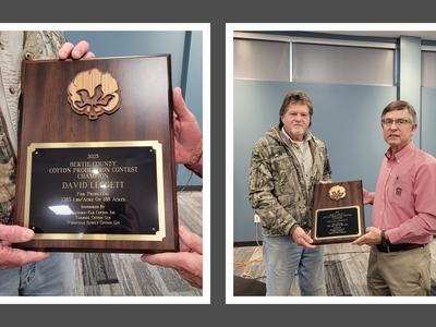 A man presented with a plaque for cotton production.