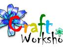 Craft Workshop logo with multicolored letters and blue flower illustration