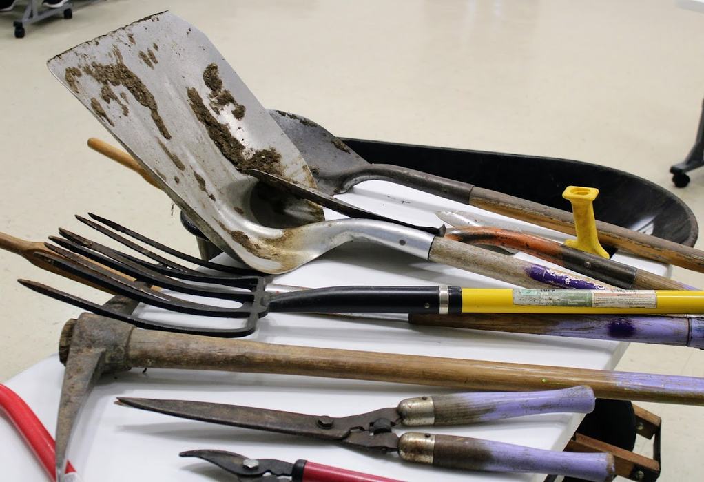 Garden tools, displayed on a table.