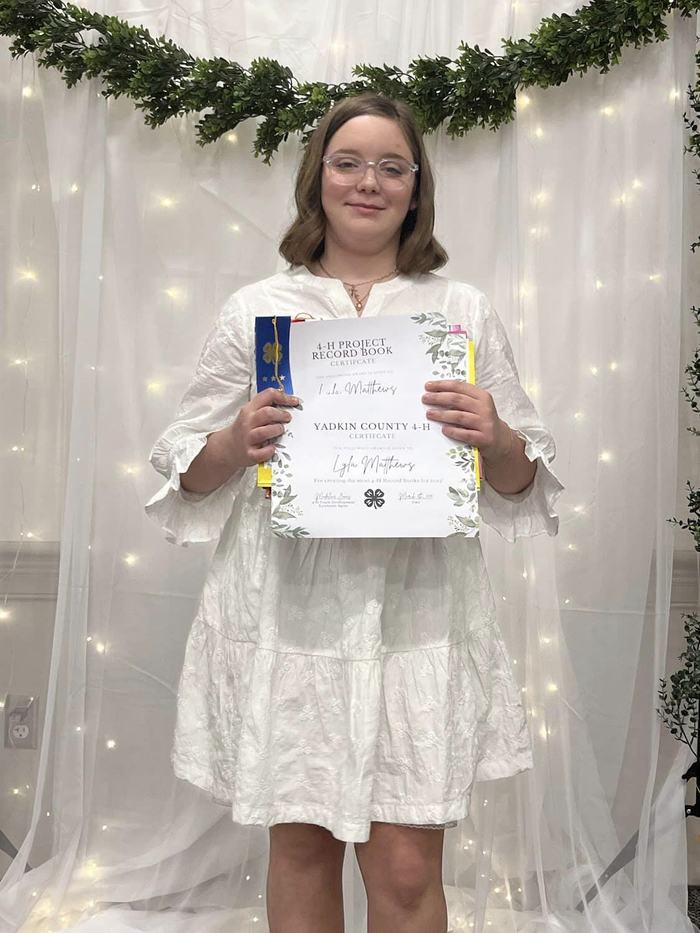 Lyla Matthews receiving her awards for all four record books she submitting and receiving the award for most record books submitted.