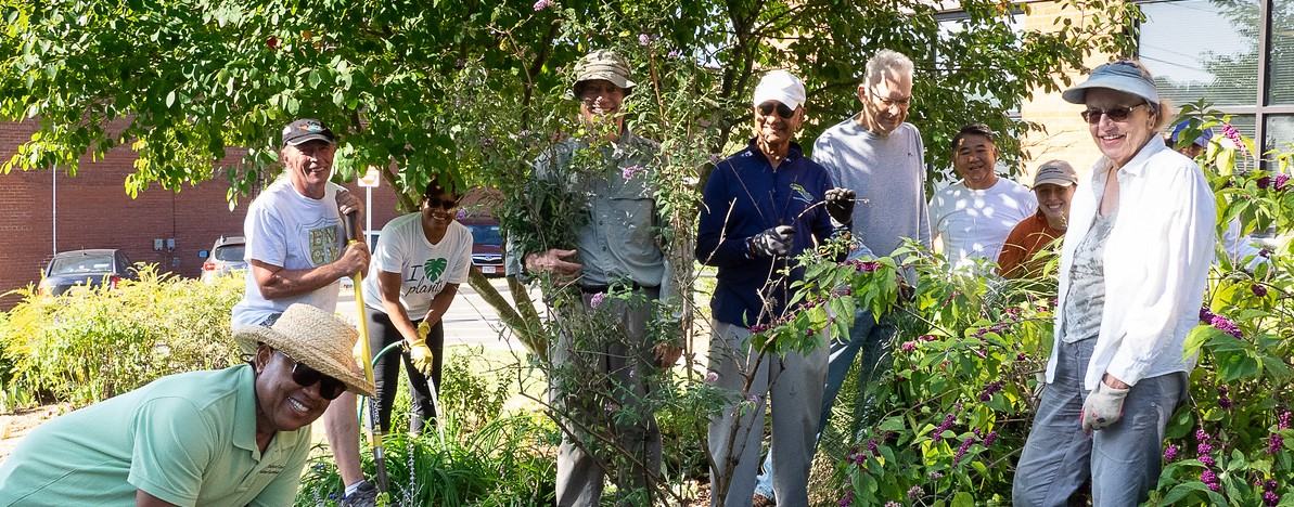A group of Extension Master Gardener volunteers pose for a picture in the demonstration garden