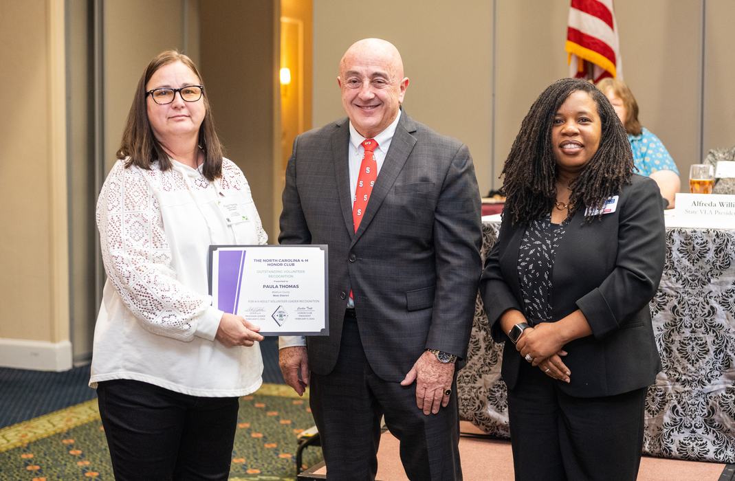 Paula receiving award with Drs. Bonanno & Terry