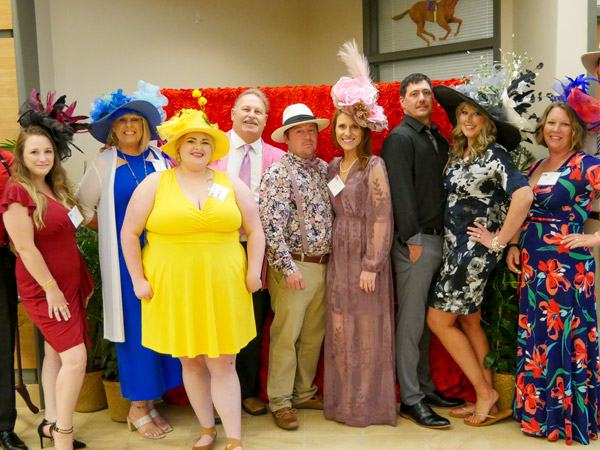 group smiling all dressed up at 2023 event