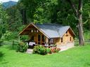 image of small wooden house with a porchImage
