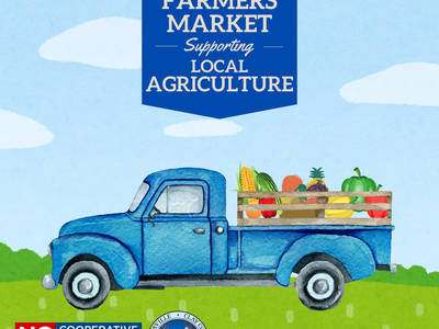 Blue pickup truck with produce under banner reading "Clay County Farmers Market"