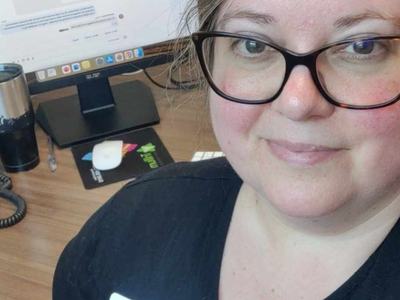 Image of Rebecca Jinnette, the Digital Skills Agent for the Bertie County N.C. Cooperative Extension, sitting at her desk