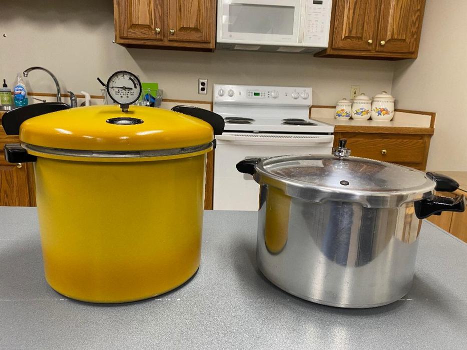 2 canners, one dial gauge canner and one weighted gauge canner.