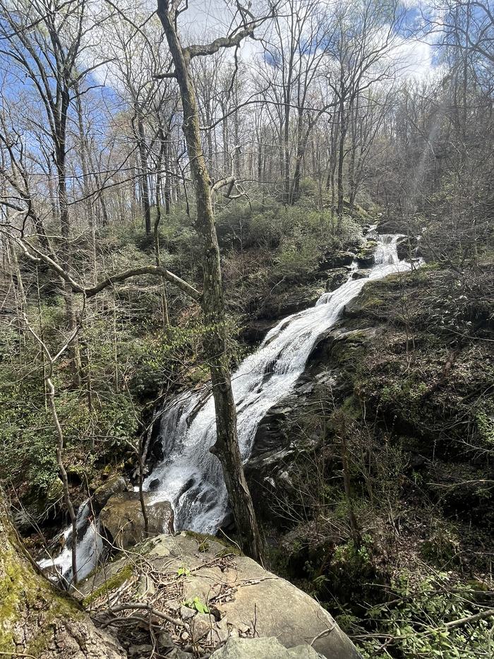 A large waterfall flows down a mountain.