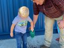 student watering plants