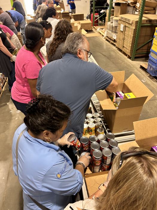 team packing food boxes at the foodbank