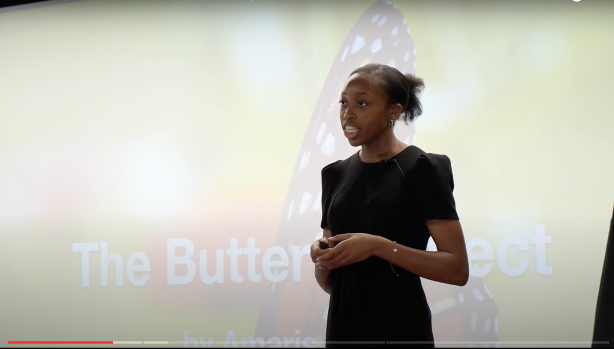 Young speaker delivers a TED talk