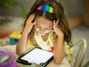 young girl looking at a tablet