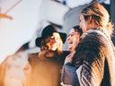 women talking and laughing