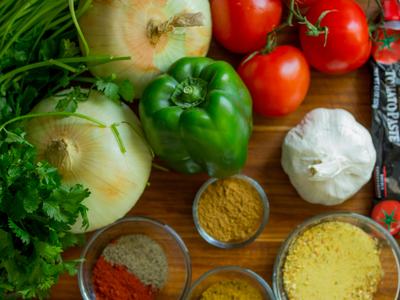 vegetables, herbs, and spices on cutting board