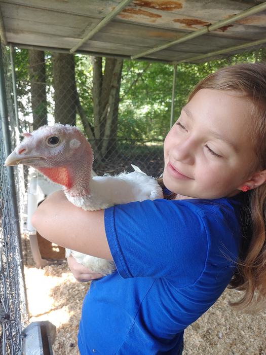 youth holding turkey
