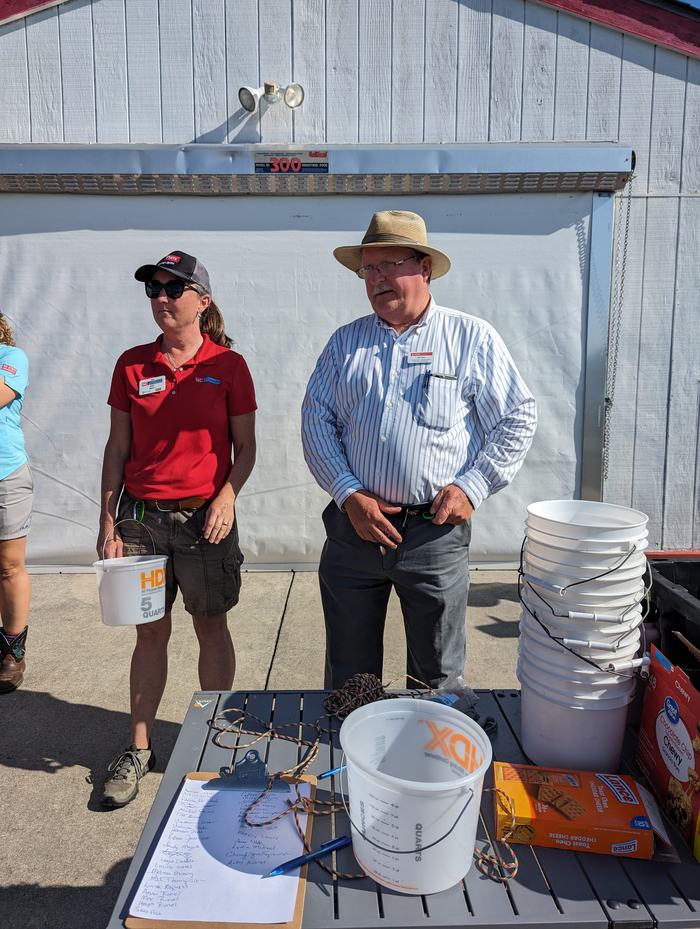 Amy Mead (left) County Extension Director from Brunswick County and Bill Cline, Extension Horticulture Specialist with NC State Extension and NCSU giving instructions to the blueberry pickers at the NCSU Horticultural Crops Research State in Castle Hayne.