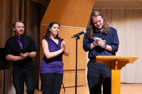 On the far left, Malachi Schwartz West District Vice President, and member of Caldwell County 4-H presents awards at the 2024 4-H West District Activity Day with his fellow district officers.