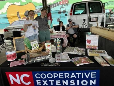 N.C. Cooperative extension table at a farmers market.