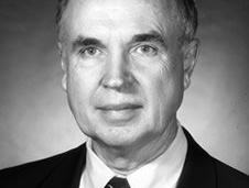 Photo of man dressed in suit with tie