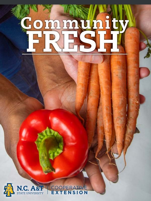 Hands holding red pepper and carrots; text "Community FRESH" and N.C. A&T Cooperative Extension