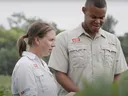 two NC State Extension Agents working in the Field