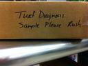 Cardboard box labeled "Turf Diagnosis Sample Please Rush" in black marker