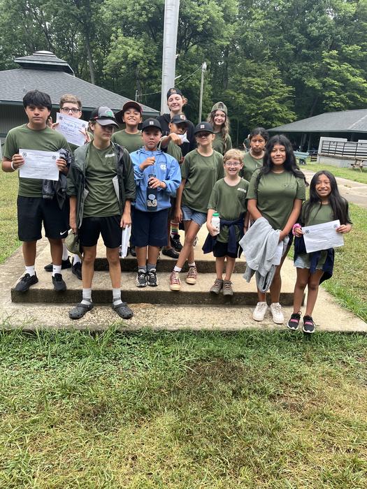 Children and Teenage campers pose together.