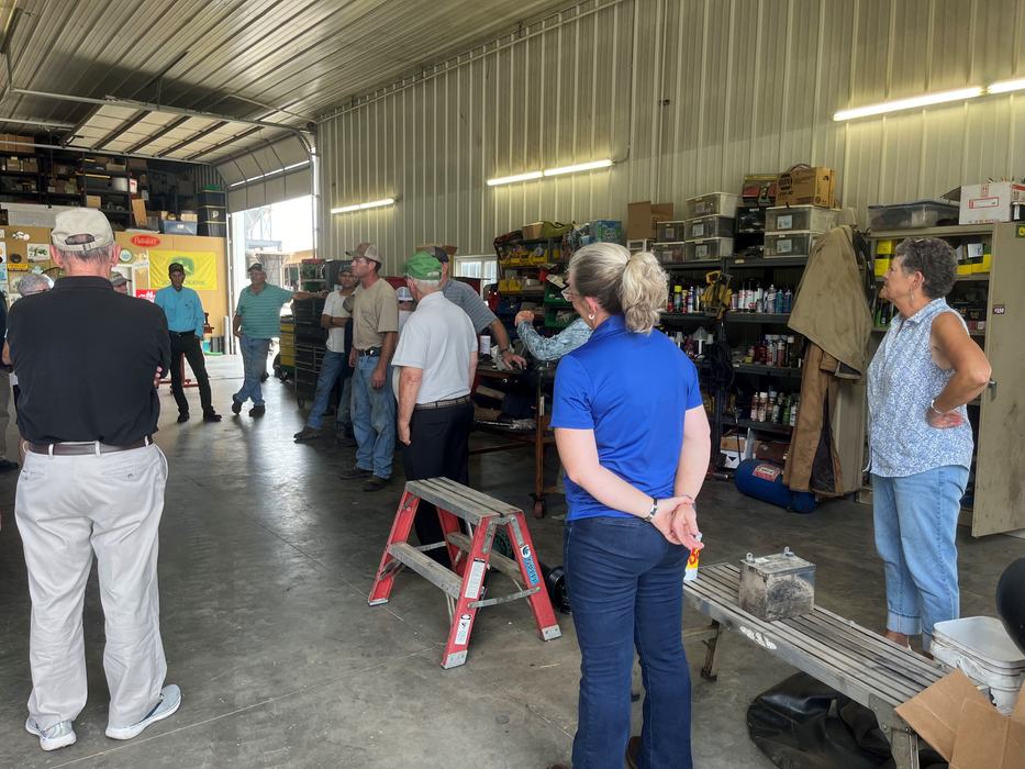 The Virginia tour group in farmer's shop.