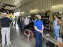 The Virginia tour group in farmer's shop.
