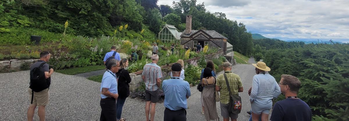 people touring Naumkeag Estate; waling on path within garden