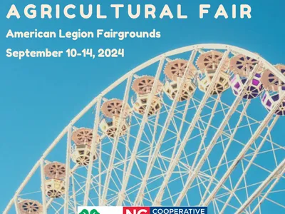 Ferris wheel with text 'STOKES COUNTY AGRICULTURAL FAIR' and dates 'September 10-14, 2024'