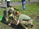 Two Ukraine soldiers plant a tree