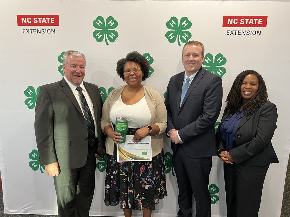 Crystal Starkes holding award certificate 