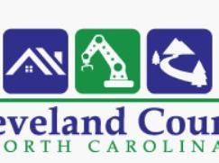 Cleveland County North Carolina logo with three icons: house roof, robotic arm, curving road